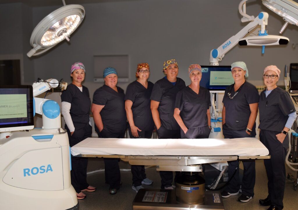 Memorial Hospital's Wortman Surgery Center Team, with MCHI's new ROSA robotic surgical assistant technology for knee replacement.
